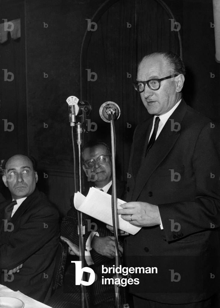 Guy Mollet, Pronouncing A Speech, in Presence of Gerard Jaquet, French Minister of Information, and Pierre Gueze (Trade Union of Daily Papers) November 9, 1956 (b/w photo)