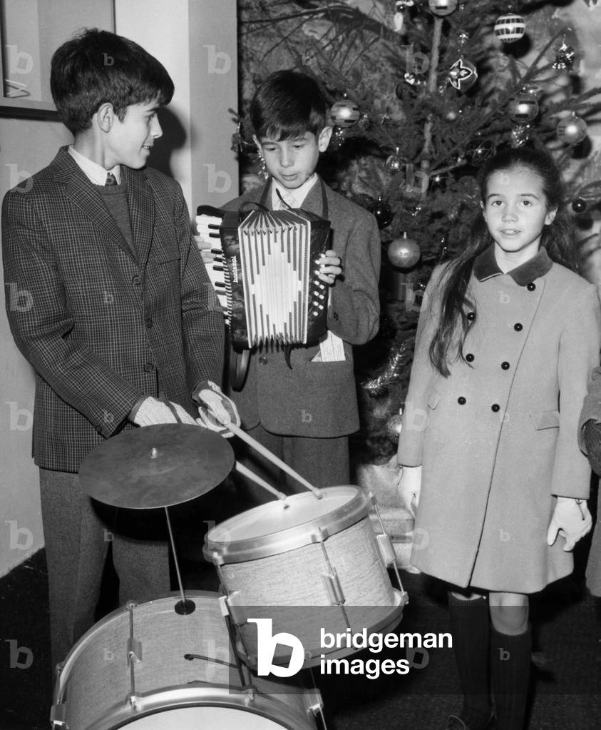 Children of Valery Giscard D'Estaing (L-R) : Louis Joachim, Henri and Jacinte Giscard D'Estaing at A Toys Exhibition on November 14, 1968 in Paris (b/w photo)