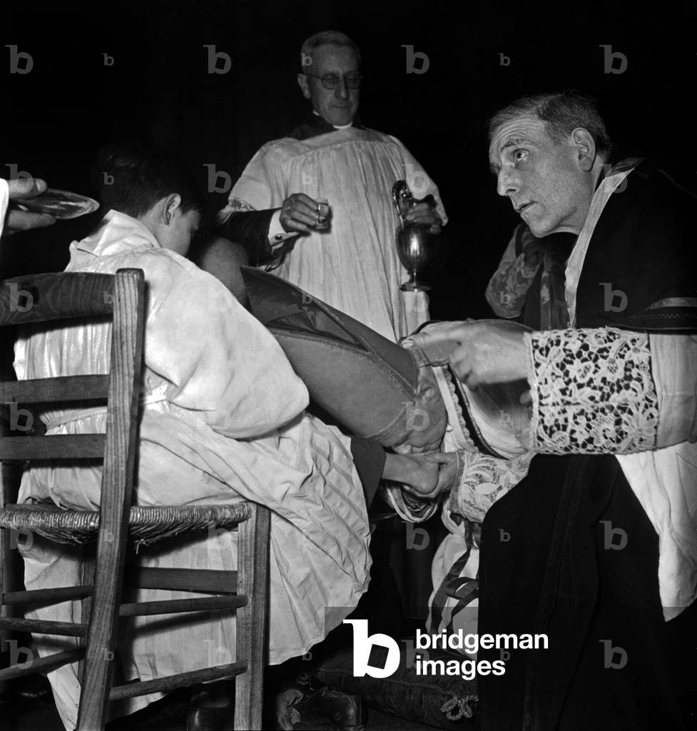 French Cardinal Emmanuel Suhard, Archbishop of Paris, during The Ceremony of Foot Washing, April 5, 1947 (b/w photo)
