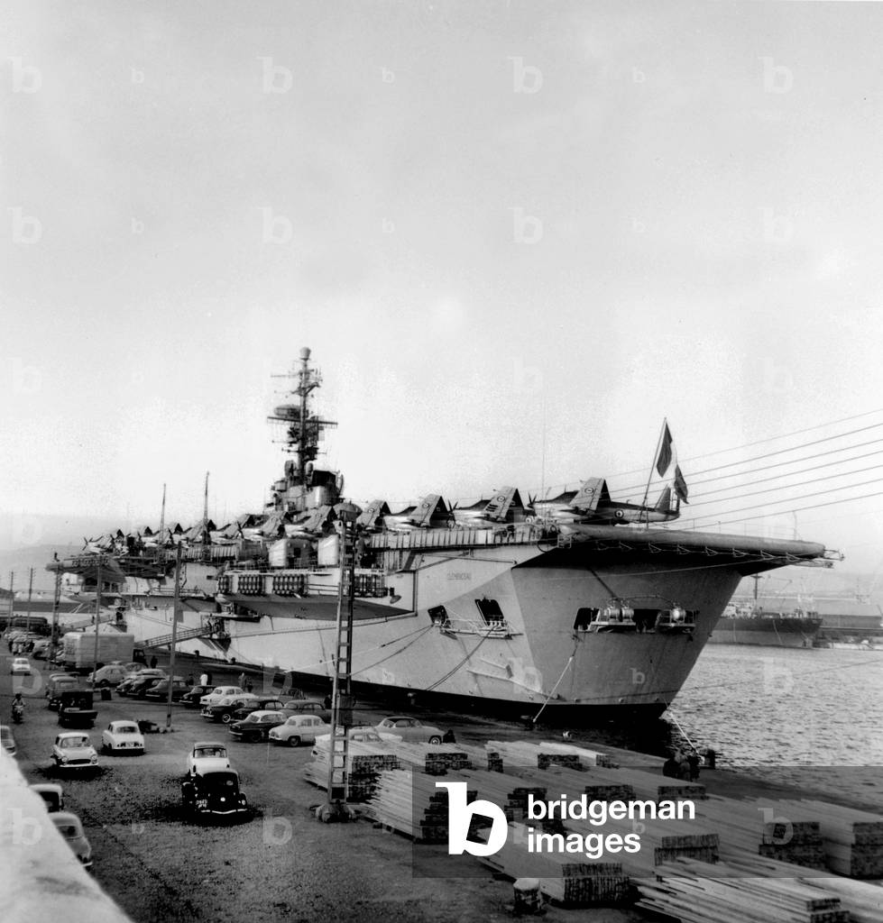 The Clemenceau, First Aircraft Carrier Built in France, Carrying Fighter Aircrafts in Marseille Harbour January 16, 1961 (b/w photo)