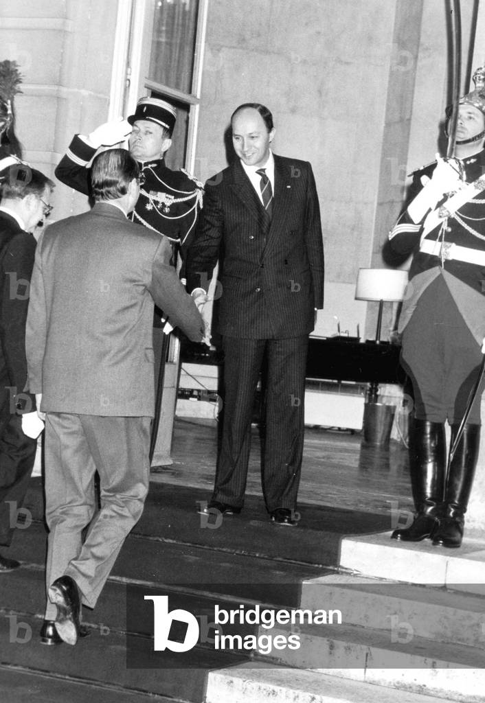 Outgoing French Prime Minister Laurent Fabius (R) Shaking Hands With his Successor Jacques Chirac during Transfer of Powers March 21, 1986 Beginning of Political Opposition of The Right Wing Majority Garde Republicaine Republican Guard (b/w photo)