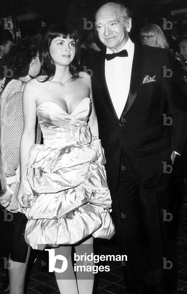 Eddie Barclay and his Fiancee Caroline Giganti Arriving at Cannes Film Festival on May 17, 1988 (b/w photo)