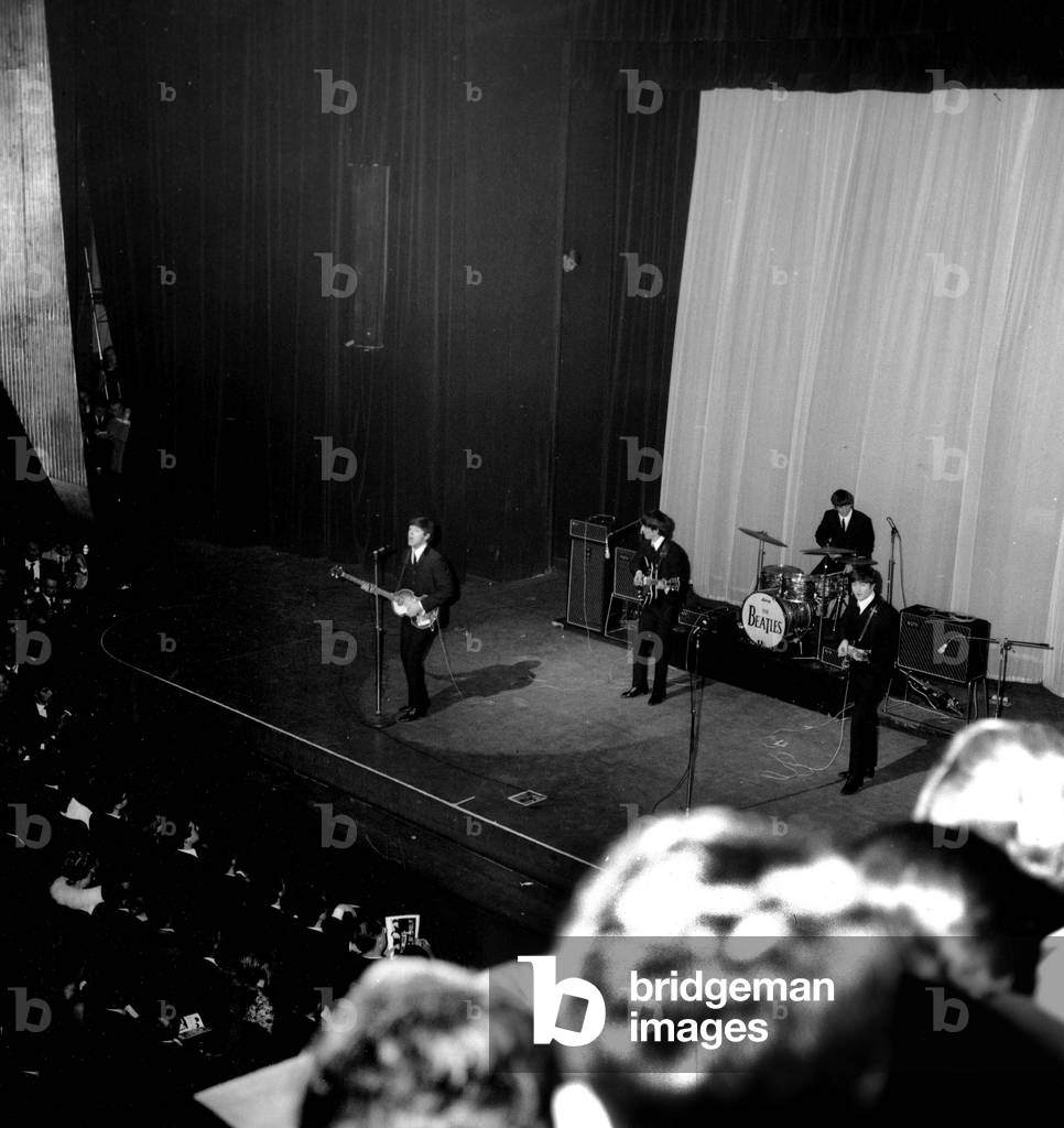 The Beatles: Paul McCartney, George Harrison, John Lennon and Ringo Starr on January 17, 1964 at The Olympia in Paris (b/w photo)