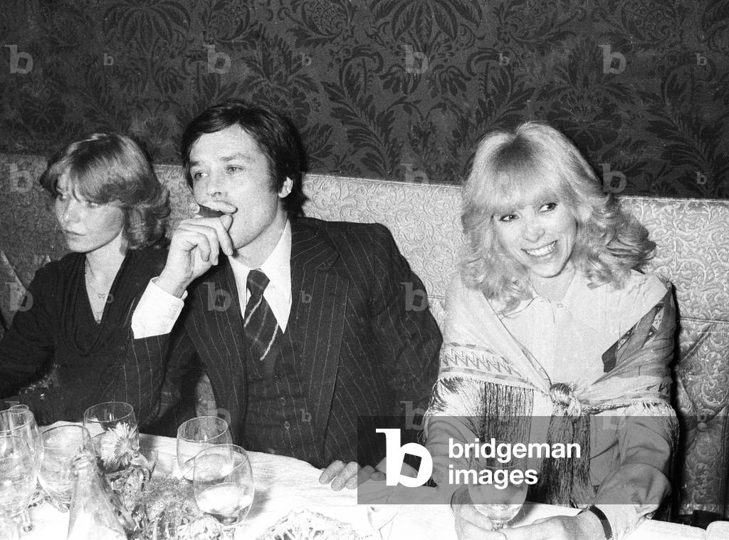 Mireille Darc and Alain Delon in a Mexican restaurant in Paris, January 6, 1977 (b/w photo)