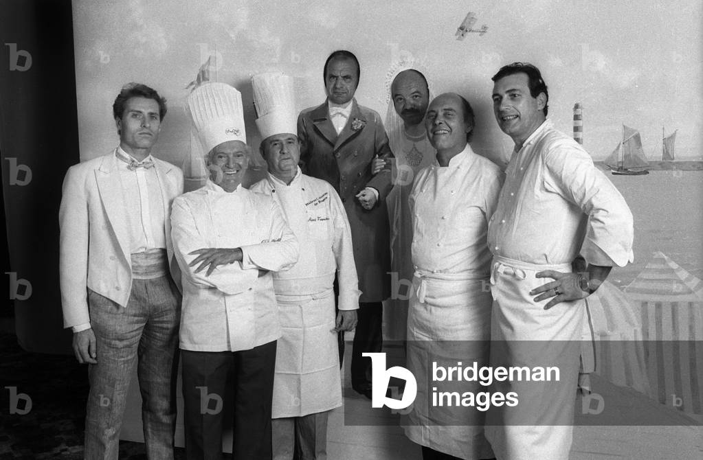 Cooks at the wedding of EddieBarclay and CathyEsposito at the Pavillon d'Armenonville, Paris, June 22, 1984 : Gaston Lenotre and Paul Bocuse (2nd and 3rd from l) (b/w photo)