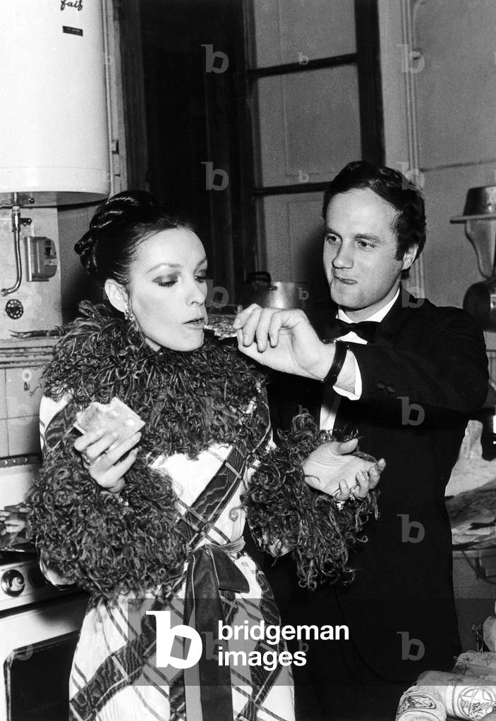 French Actress Marie Laforet wearing a Tartan Dress and Feathers with her Fiance Alain Kahn Schriber, 28 September 1971 (photo)