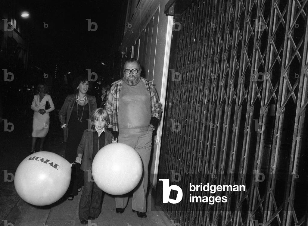 Italian film director Sergio Leone (1929-1989) leaving the Alcazar with his family in Paris, on September 6, 1976 (b/w photo)