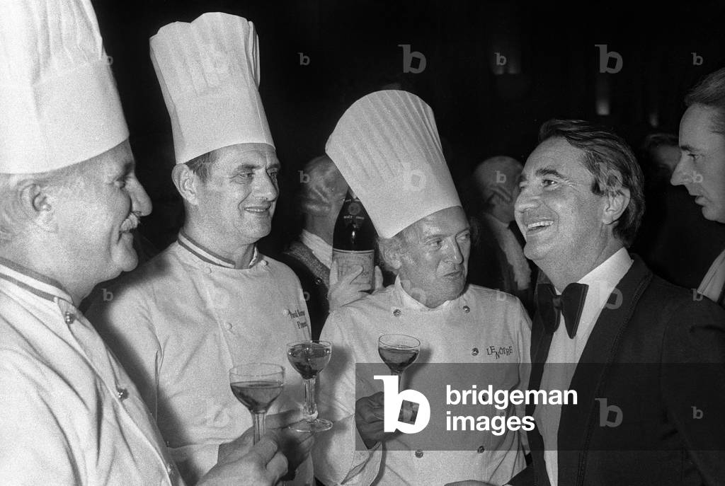 Party organized in Versailles by french politician Jean Pierre Soisson, May 1978 : l-r : cooks Roger Verge, Paul Bocuse, Gaston Lenotre, Jean-Pierre Soisson (b/w photo)