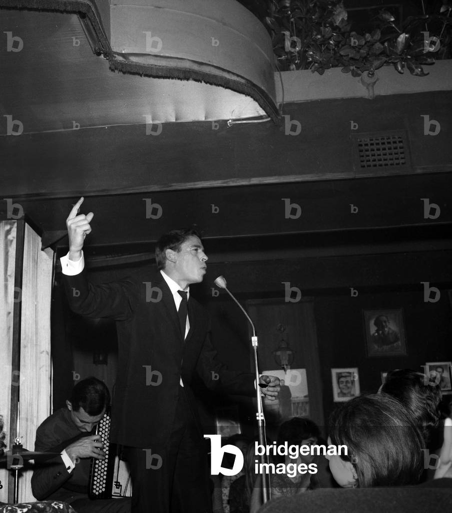 Jacques Brel celebrating his 12 years of songs at Cabaret L'Echelle de Jacob, Paris, 25 January 1965 (photo)