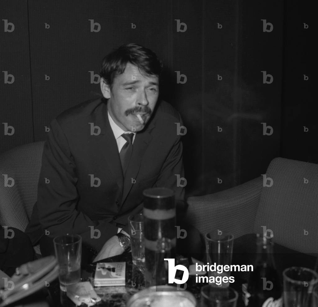 Belgian singer and actor Jacques Brel at the Ruby's Club first anniversary party in Paris, on March 18, 1968