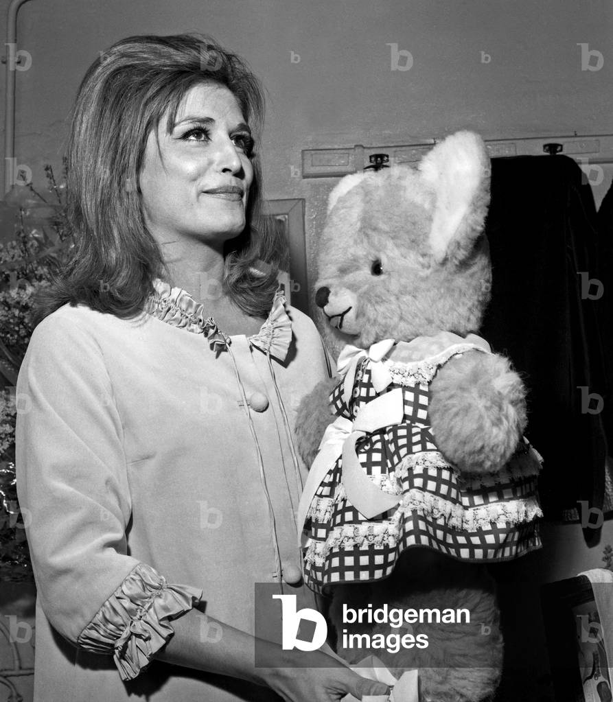 Dalida with a cuddly toy in her dressing room, during the Premiere of Dalida at Bobino, Paris, 3 February 1965 (photo)