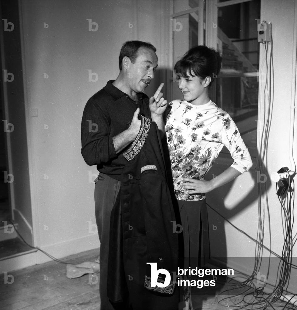 Jacques Esterel (French designer) and his daughter Jacqueline Esterel as a model in his fashion house, 1962 (photo)