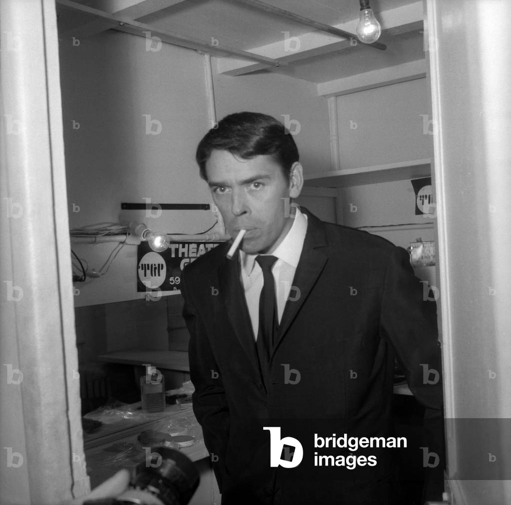 Jacques Brel smoking a cigarette in his dressing room in Saint-Denis, France, 2 January 1967 (photo)