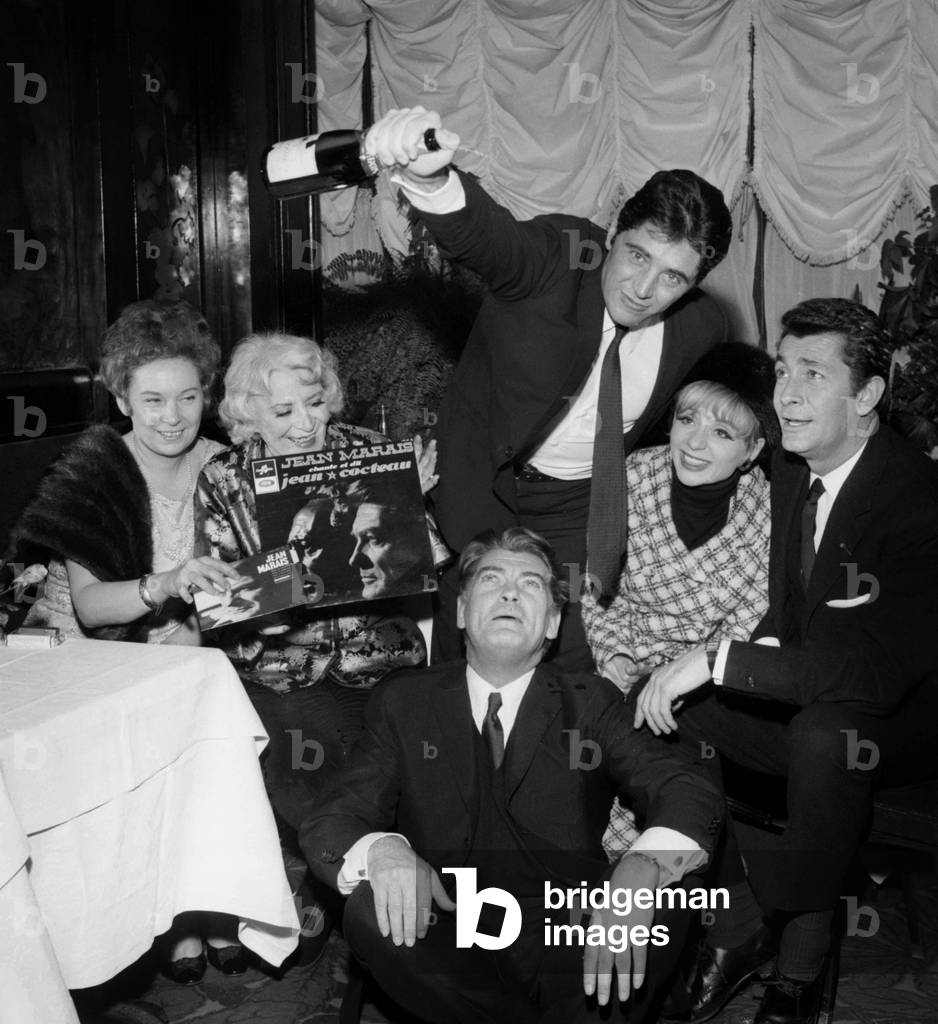 Jean Marais in front of Sacha Distel, Annie Cordy, Jean-Claude Pascal  for the Celebration of the 1st Record of Jean Marais,  Maxim's Restaurant, Paris, 18 January 1966  (photo)