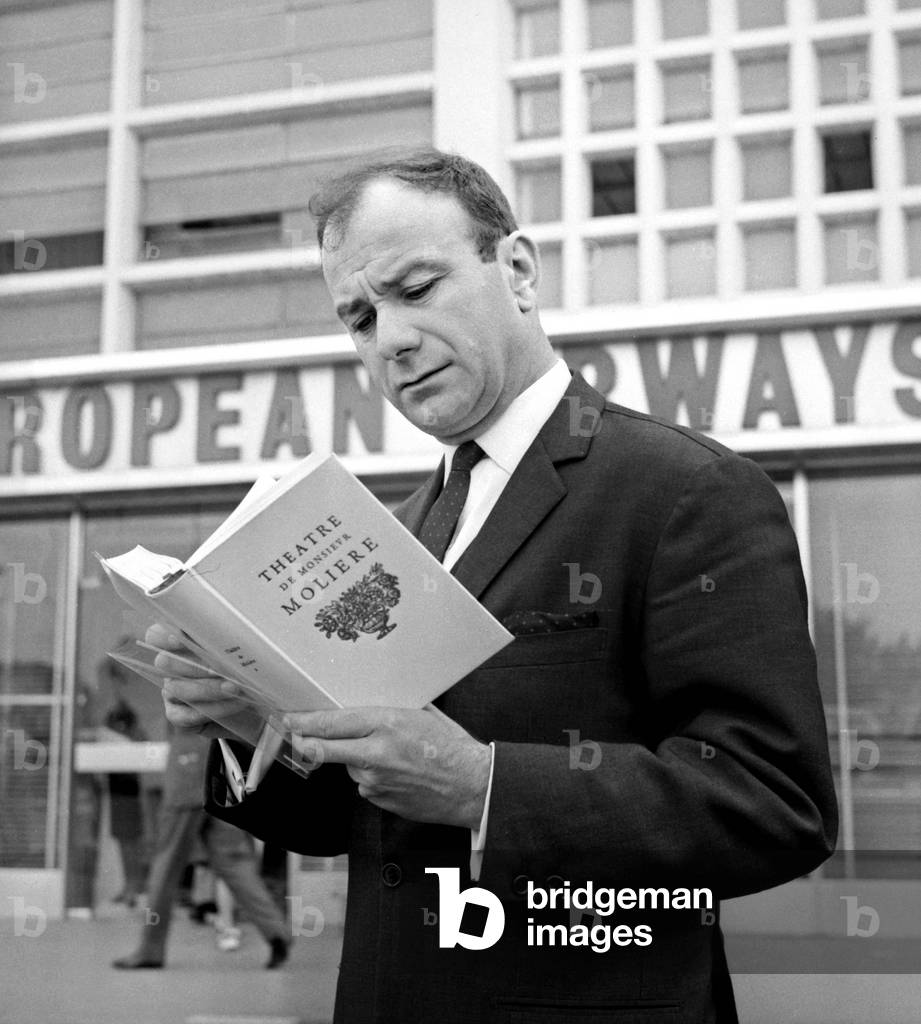 Fernand Raynaud reading a book about Moliere at Dublin Airport at the time of the 