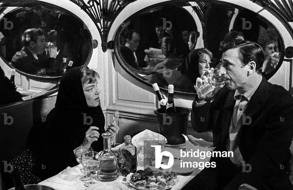 Simone Signoret and Yves Montand celebrating the 100th performance of the show of Yves Montand at the Etoile,  Paris, 12 February 1963 (photo)