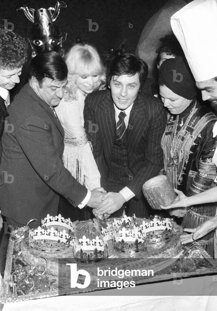 Mireille Darc and Alain Delon cutting the 