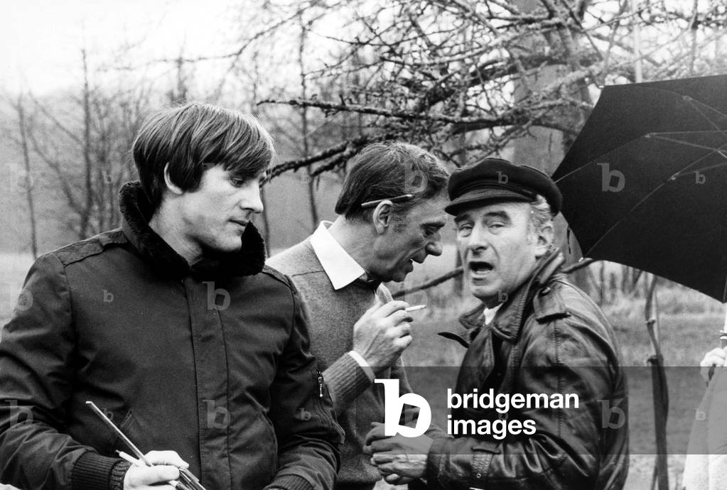Gerard Depardieu, Yves Montand and driector Claude Sautet on the set of the film 