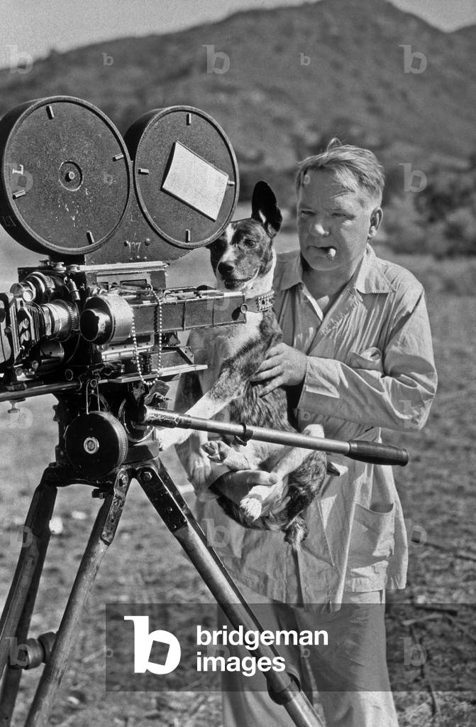 W. C. Fields with a dog behind a camera (photo)