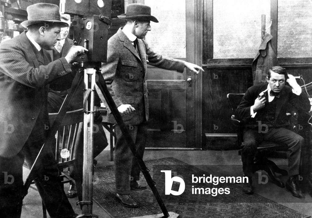 D.W. Griffith directing Henry B. Walthall while cameraman is filming c. 1916 (photo)
