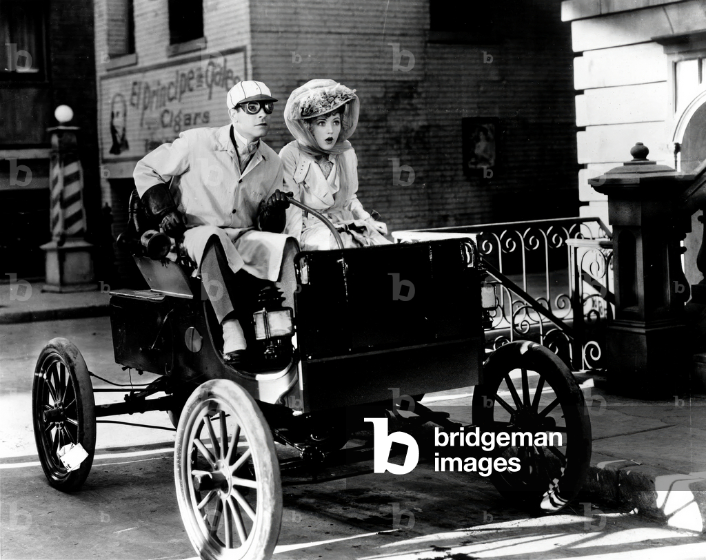 AUTOMOBILES. Lawrence Gray and Marion Davies, c. 1920s (film still)