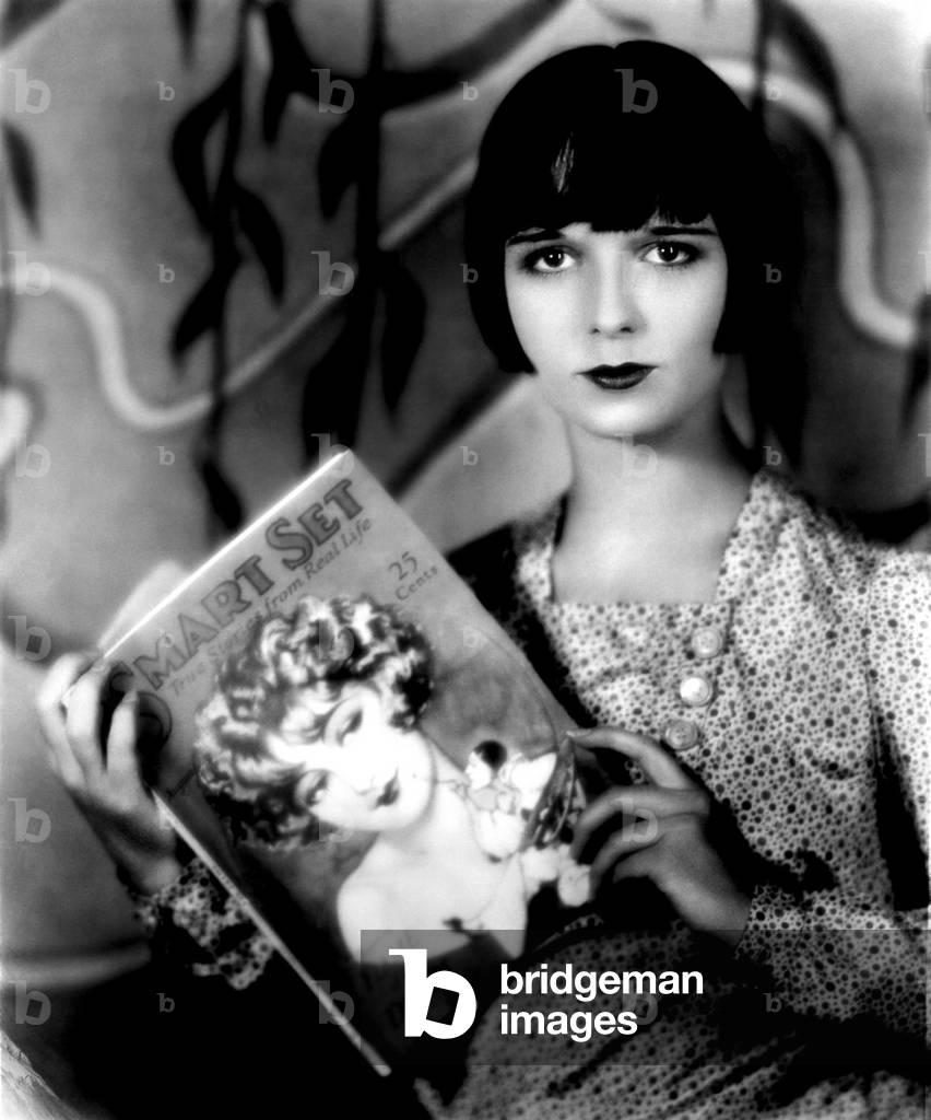 Louise Brooks holding a copy of 