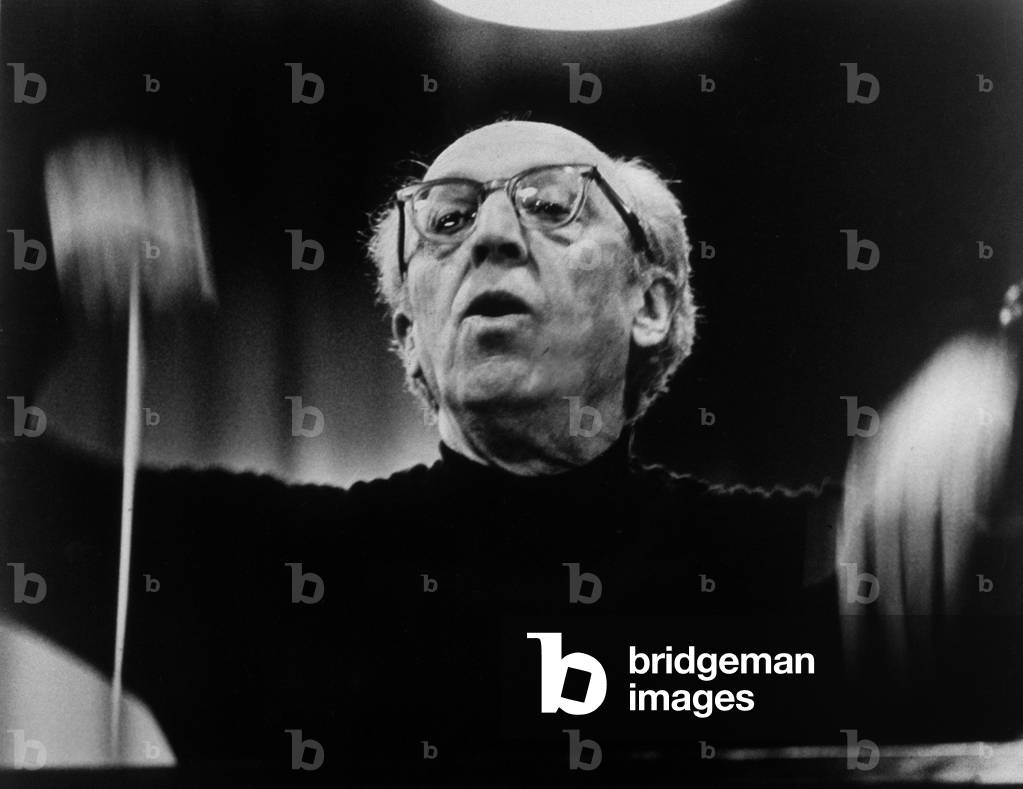 Aaron Copland (1900-90) conducting an orchestra, 1962