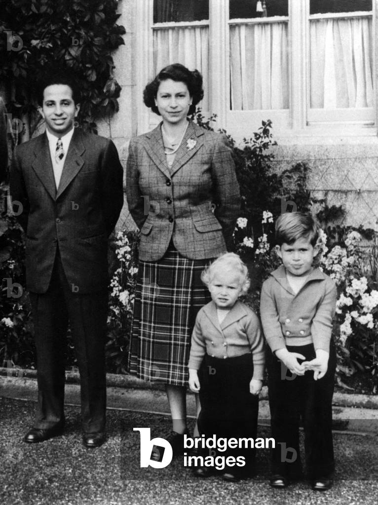 King Faysal II of Iraq during a visit to England with queen Elizabeth and children princess Ann and prince Charles September 26, 1952 (b/w photo)