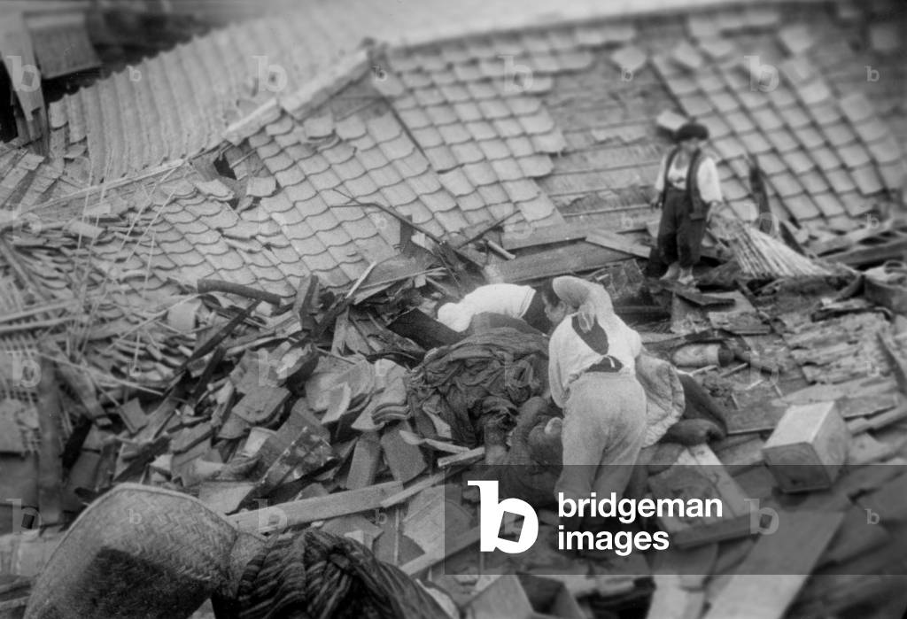 The Population of A Village Devasted By The Tsunami (Following The Earthquakes in Chile) Which Fell Down on Japan, Seek What Can Be Recovered Remains, May 28, 1960  (b/w photo)