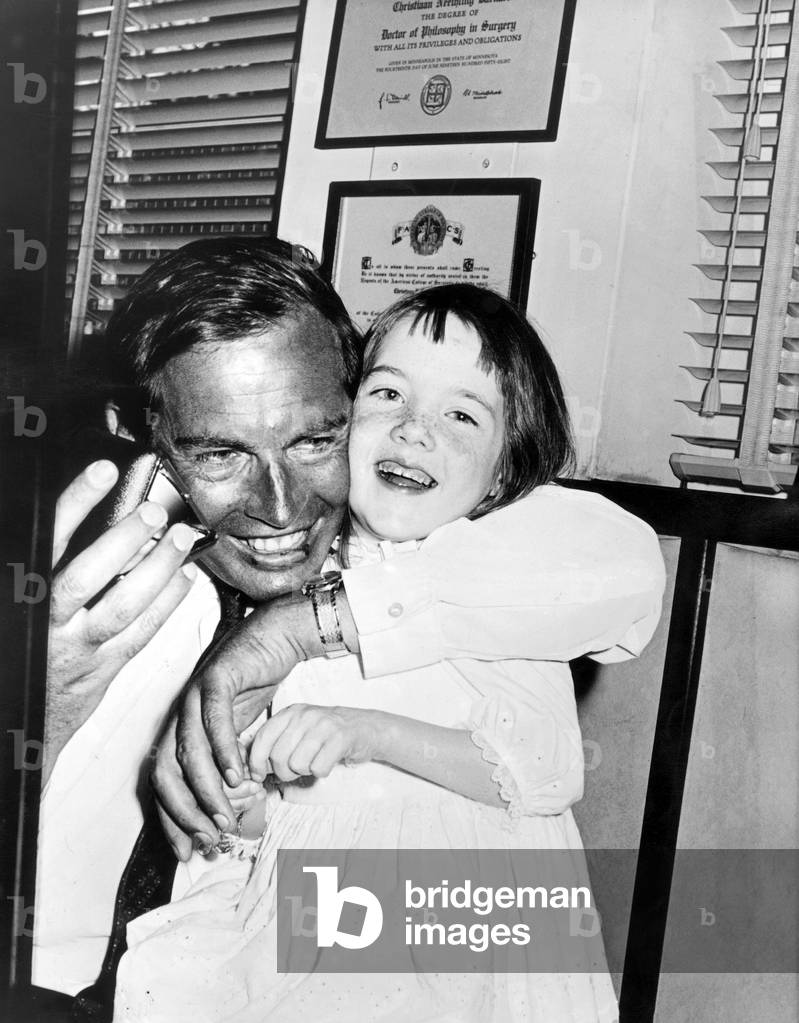 Professor Christian Barnard (1922-2001) Pioneer of Heart Transplant, With Alleen Brassil, 7 Years Old, at Hospital of Cape Town on February 19, 1969 (b/w photo)