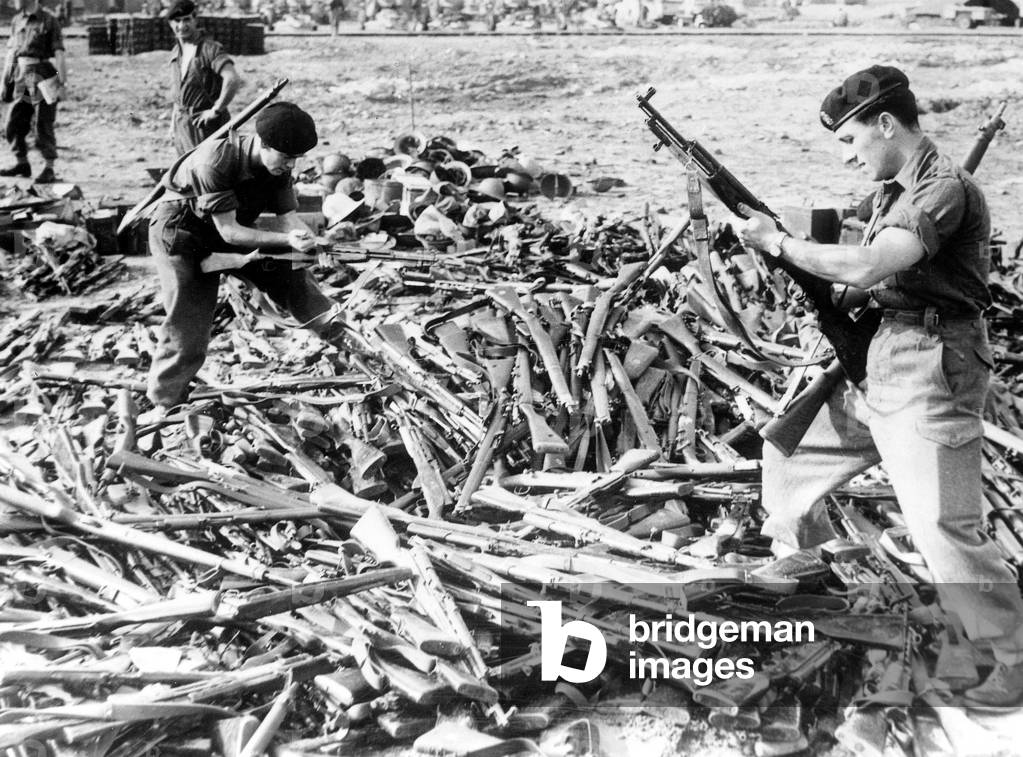 during Suez Crisis After The Fights in Port Said and Port Fouad English and French Soldiers Gathered Firearms From Egyptian Soldiers Most of Which Were Soviet and Czech Made (b/w photo)