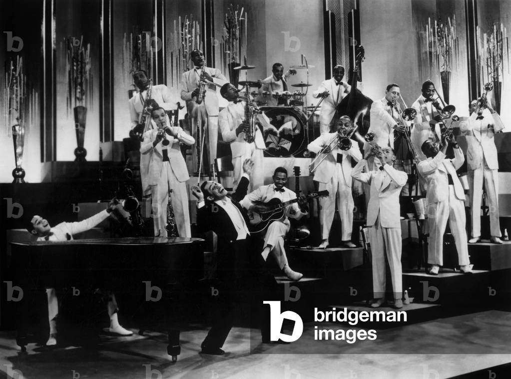 Cab Calloway (1907-1994) American Jazz Singer and Conductor here With his Band in 1937 (b/w photo)
