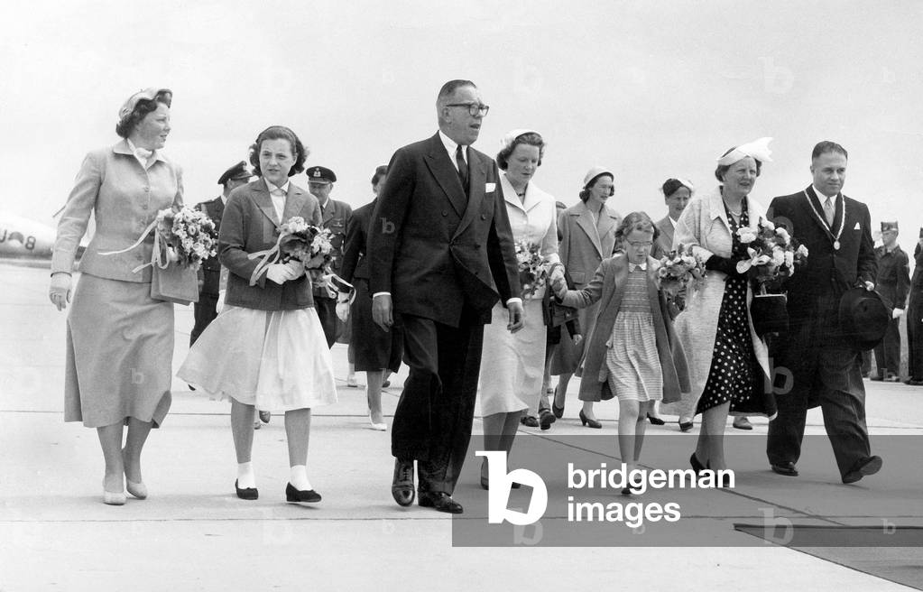 Arrival of princess Beatrix, princess Margriet, C. Kolff president of the dutch aeroclub, princess Irene, princess Marijke, queen Juliana of Holland, and burgomaster of Rijswijk A. Bogaardt  at the International aerofestival at the airport Ypenburg june 10, 1957 (b/w photo)