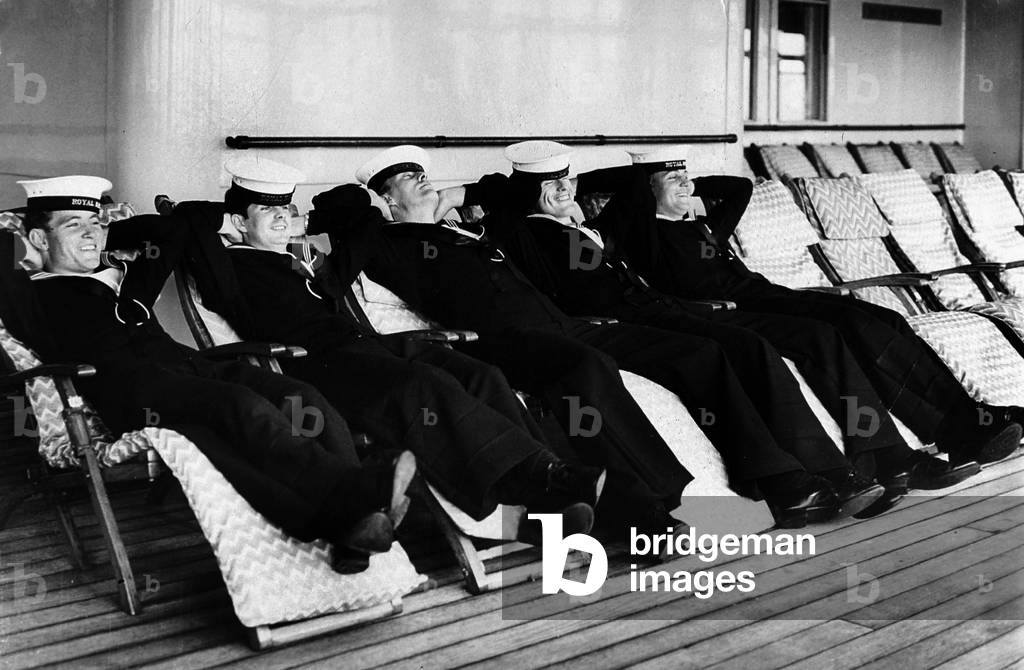 Sailors Laying on Deckchairs on Deck of Liner Queen Mary June 19, 1964  (b/w photo)