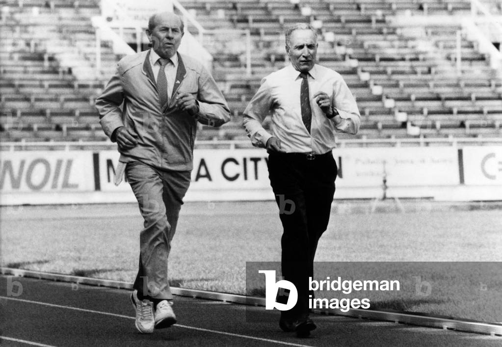 Emil Zatopek and Alain Mimoun, 36 Years After Their Race at the 1952 Helsinki Olympic Games. This is June 27, 1988, at the Olympic Stadium in Helsinki. (b/w photo)