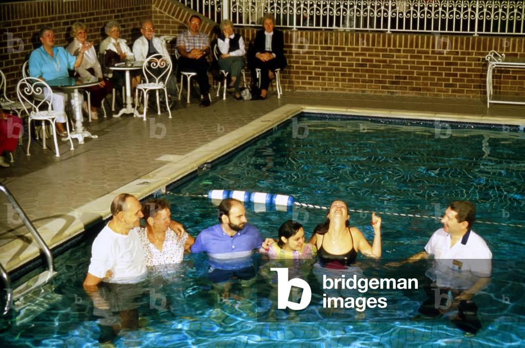 Baptism of The Faithful of Jim Bakker in Swimming Pool at Religious Center Heritage Usa at Fort Mill South Carolina in 1987 (photo)