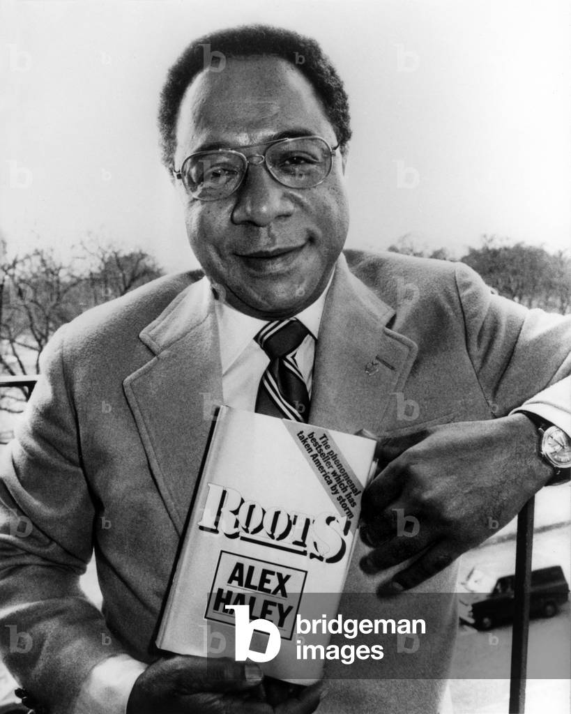 Alex Haley Holding In His Hands A Copy Of His Novel “Roots” December 28, 1977 (b/w photo)