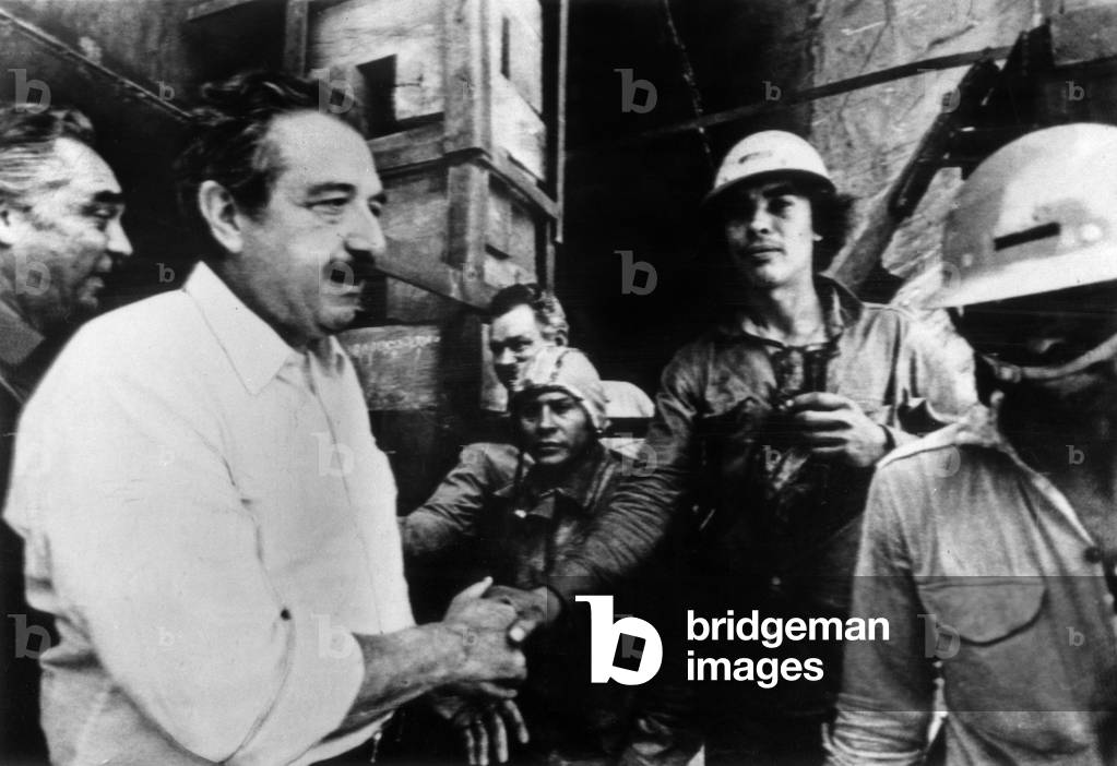 In Buenos Aires, Raul Alfonsin Shaking Hands of Workers during his Election As President of Argentina December 9, 1983 (b/w photo)