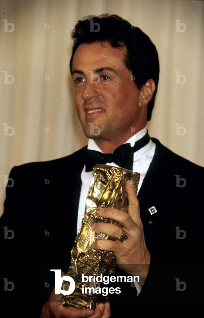 American Actor Sylvester Stallone Receiving A Cesar of Honor on February 22, 1992 in Paris (photo)