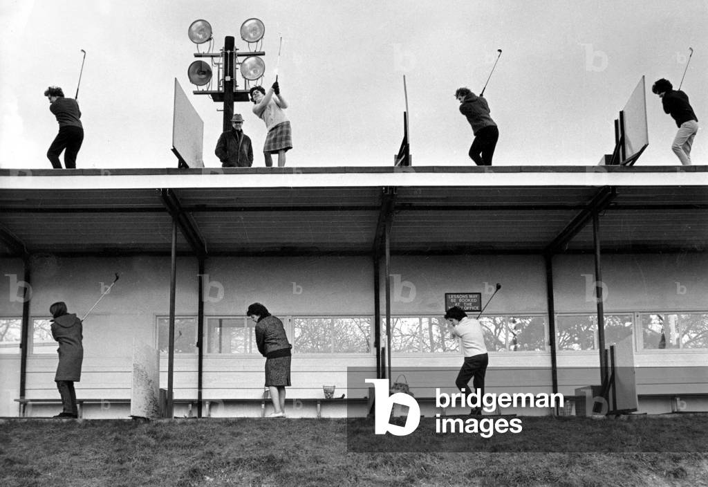 Golfers Training For Swing at Croydon Driving Range March 10, 1965 (b/w photo)