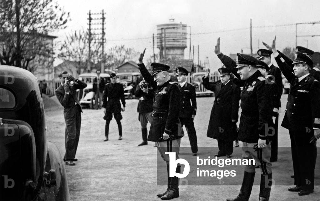 In Monfalcone on May 7, 1941, Benito Mussolini and Count Gian Galeazzo Ciano (Italian Minister of Foreign Affairs) Saluting Croatian Leader Ante Pavelic (b/w photo)