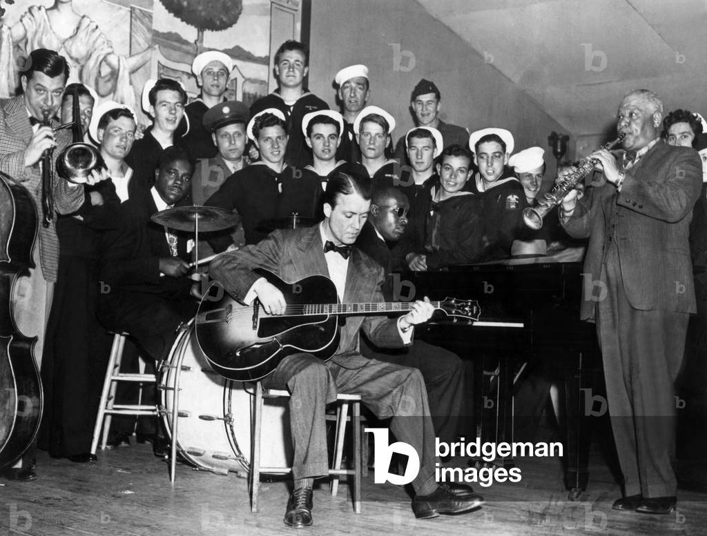 Sidney Bechet (1897-1959) Jazzman Clarinettist Saxophonist Composer and Conductor here Playing Clarinet in Front of Sailors C. 1948 With Eddy Condon (Guitar), Brad Gowans (Trombone) (b/w photo)