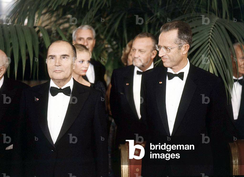 French President Francois Mitterrand and King  Baudouin 1st of Belgium in Brussels on October 12, 1983. Background on r : Charles Hernu, French minister of defence