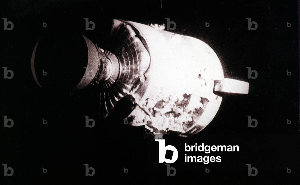 Space module of Apollo XIII damaged by explosion of the oxygen tanks in sector 4 ; the picture is taken from lunar module which served as lifeboat for the crew April 1970