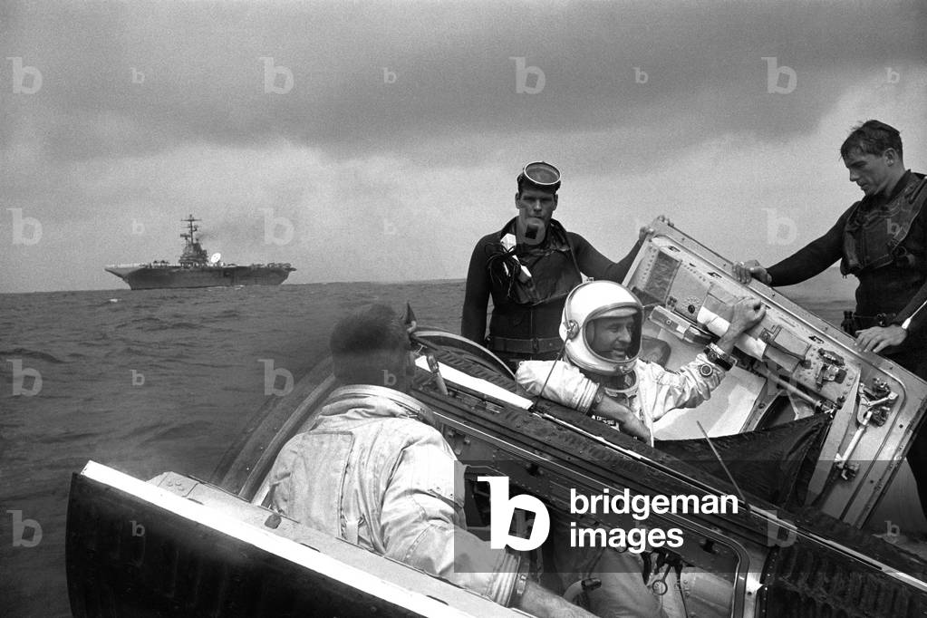 06/06/66 Astronauts Thomas P. Stafford and Eugene A. Cernan sit with their Gemini spacecraft with hatches open while awaiting the arrival of the recovery ship U.S.S. Wasp.