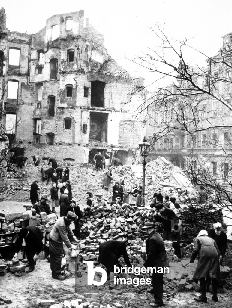 Voluntary civil workers clearing the city of Dresden, Germany of its debris after the heavy bombings in the closing days of the war, 1945
