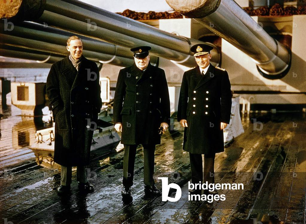 Winston Churchill between member of war cabinet Stafford Cripps from labour party and Admiral of the Fleet Lord Tovey (1885 - 1971) some times after the -Bismarck Drowning, here aboard the 