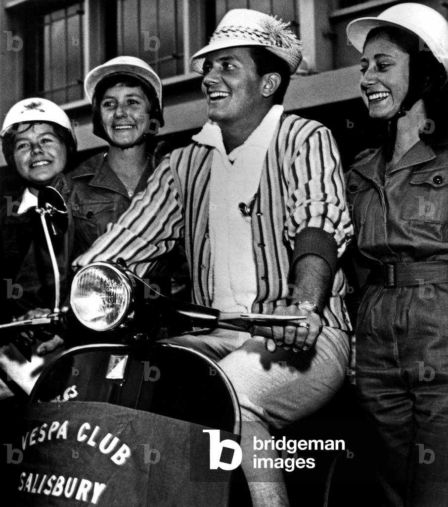 American Singer Pat Boone greeted by his fans in Salisbury airport during tour in Rhodesia July 26, 1961 scooter Vespa