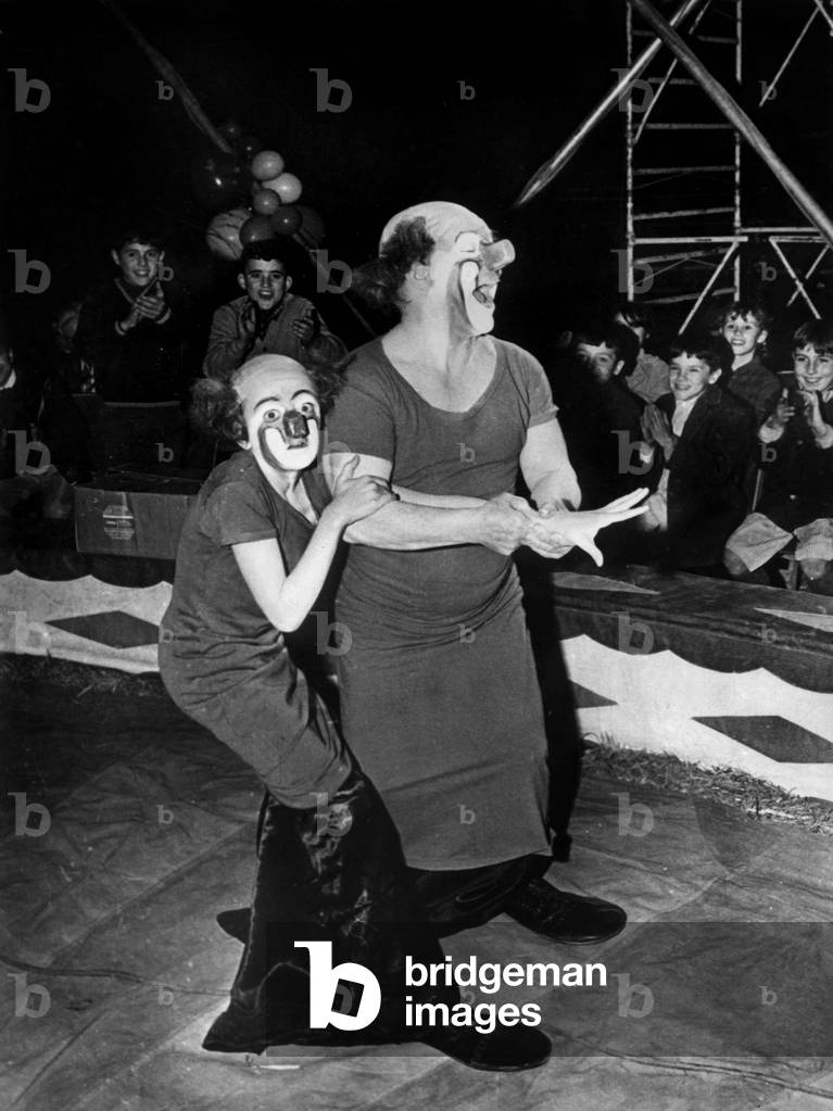 Charlie Rivel and a young clown apprentice during the shooting of the film “The clown apprentice” on the circus track in Cubellas (Spain) on February 12, 1967