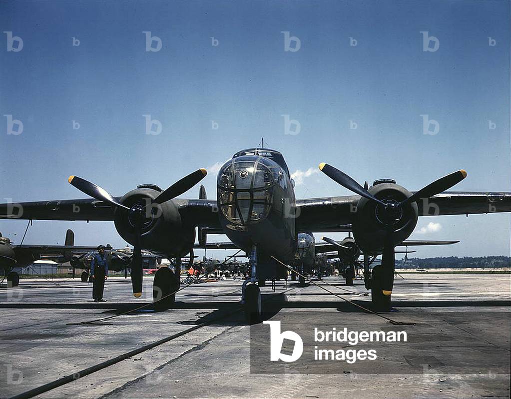 B-25 bombers on the outdoor assembly line at North American Aviation, Incorporated, almost ready for their first test flight, Kansas City, Kansas Oct 1942